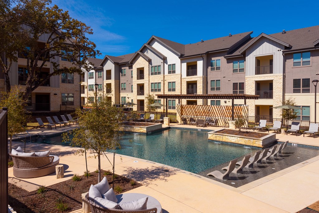 our apartments have a large pool and lounge chairs
