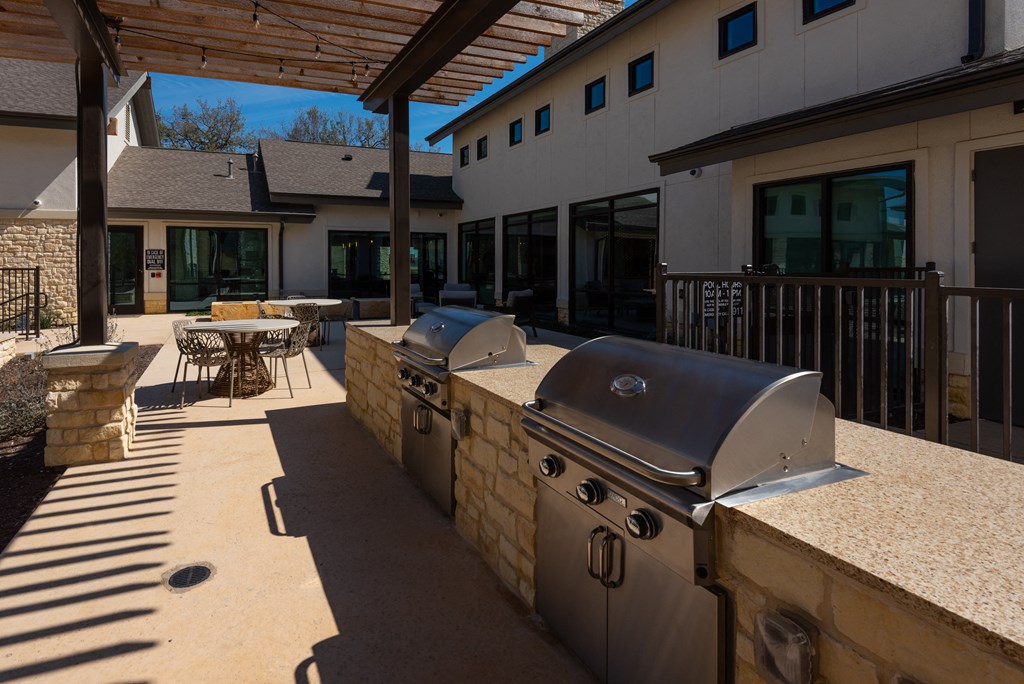 outdoor community area with grills for cooking at ironridge apartments