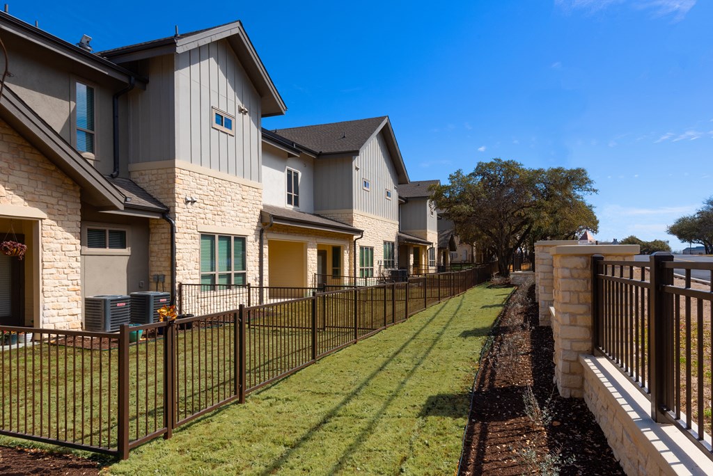 new homes with fences at the preserve at polo ridge