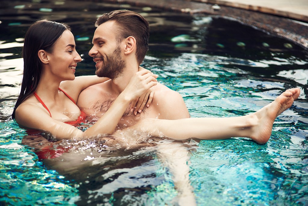 A man and woman in a pool.