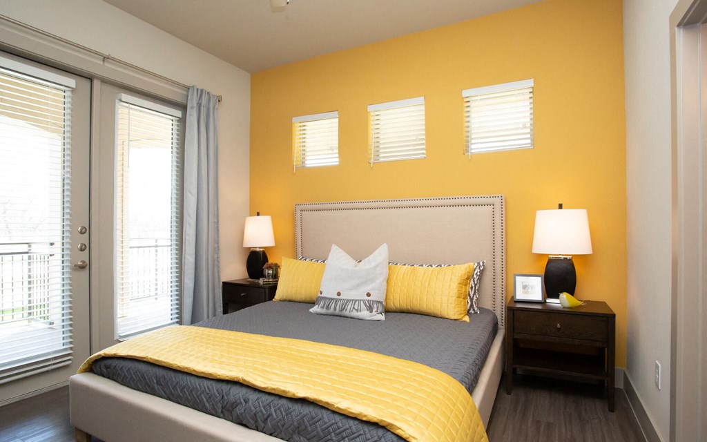 bedroom at mela's apartments in san antonio