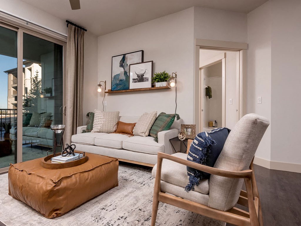 a living room with a couch and a chair