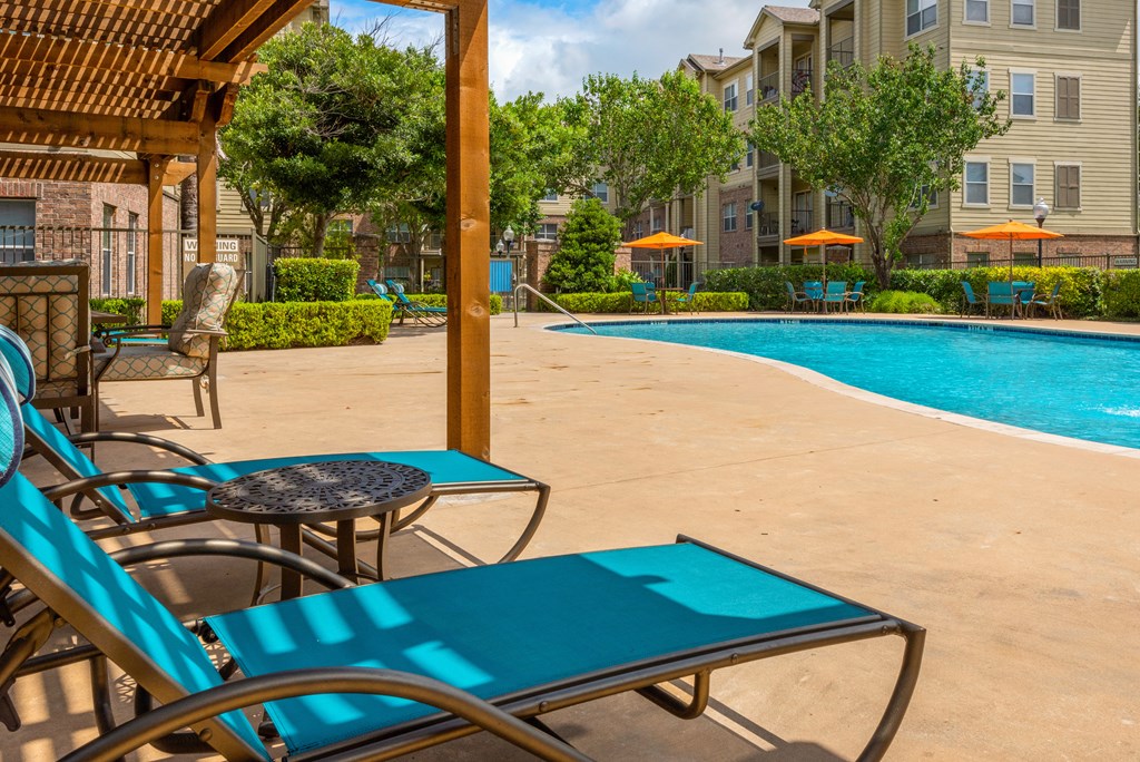 our apartments have a large pool and lounge chairs