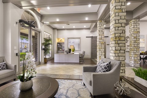 a living room with couches and a table