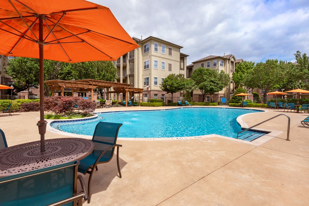 our apartments have a large swimming pool with umbrellas