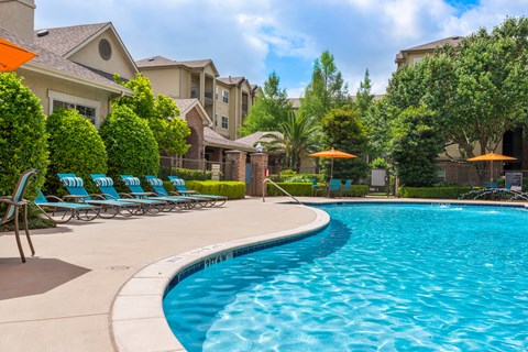the swimming pool at the preserve at polo towers apartments