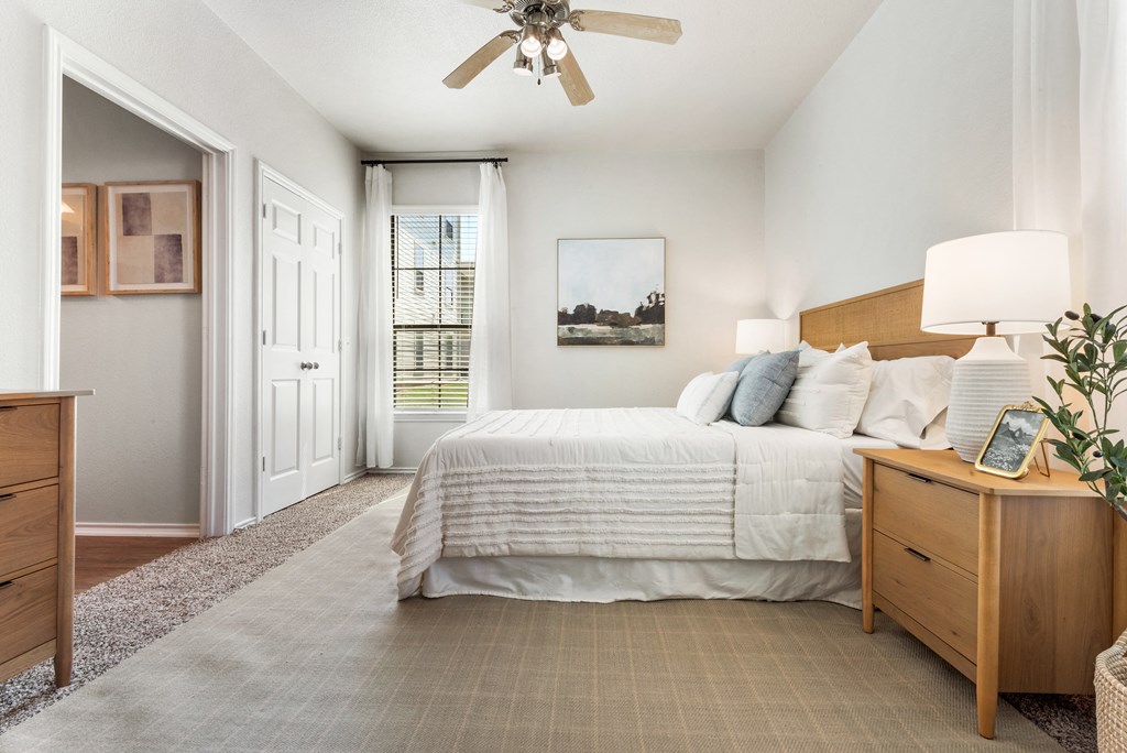 a bedroom with a large bed and a ceiling fan  at Hayden on West Ave, San Antonio, Texas