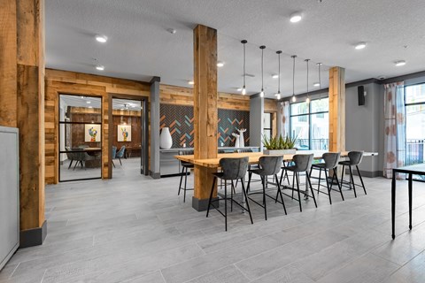 a large dining room with chairs and a table