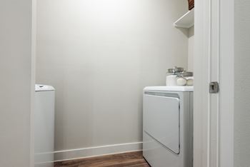 a small laundry room with a washer and dryer