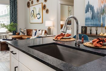 a kitchen with a sink and a faucet