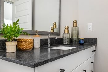 a bathroom with a sink and mirror