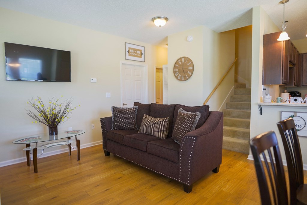 a living room with a couch and a table