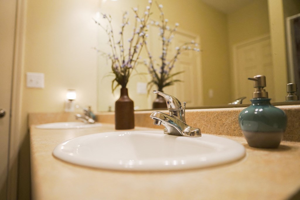 Sink with floral decor on the counter