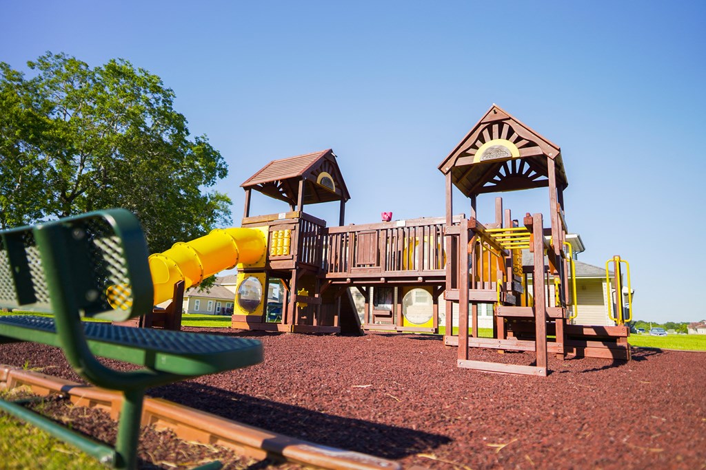 a playground with a swing set and other play equipment