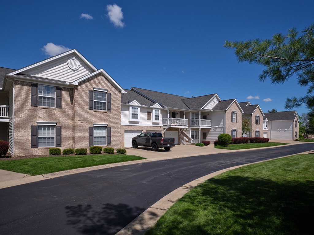 a car parked in front of an apartment building