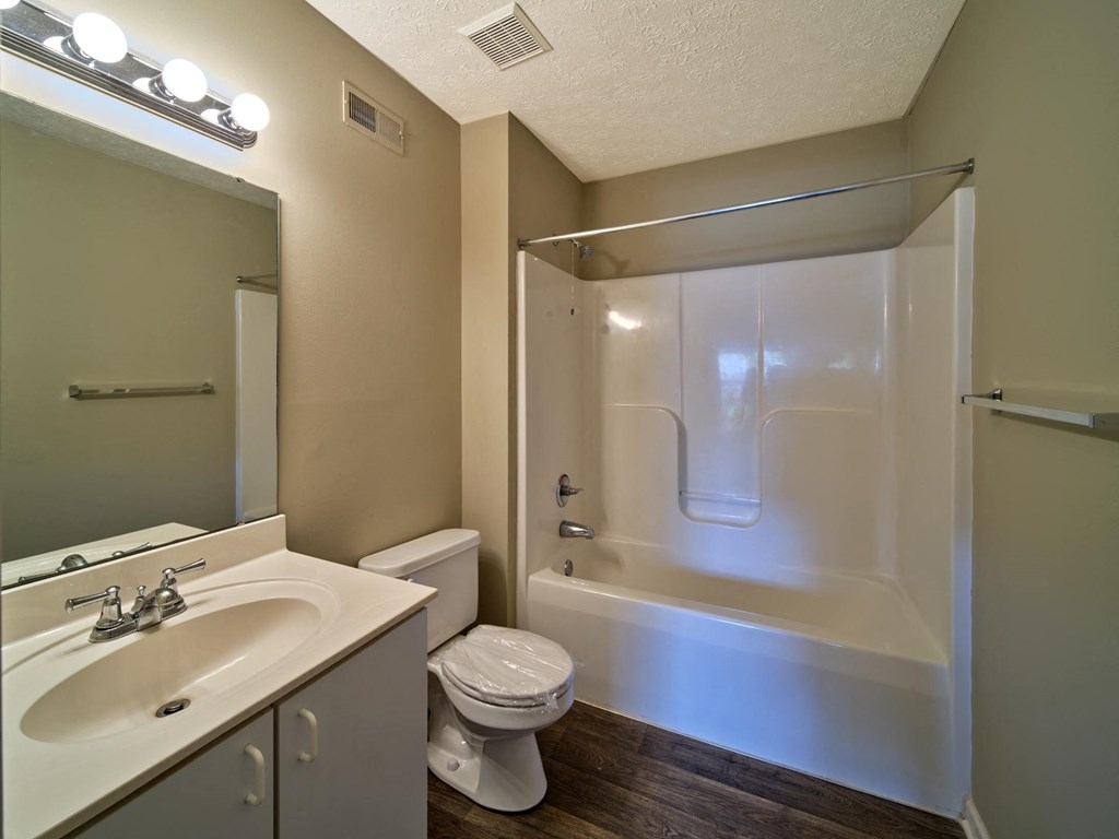 a bathroom with a sink toilet and a shower