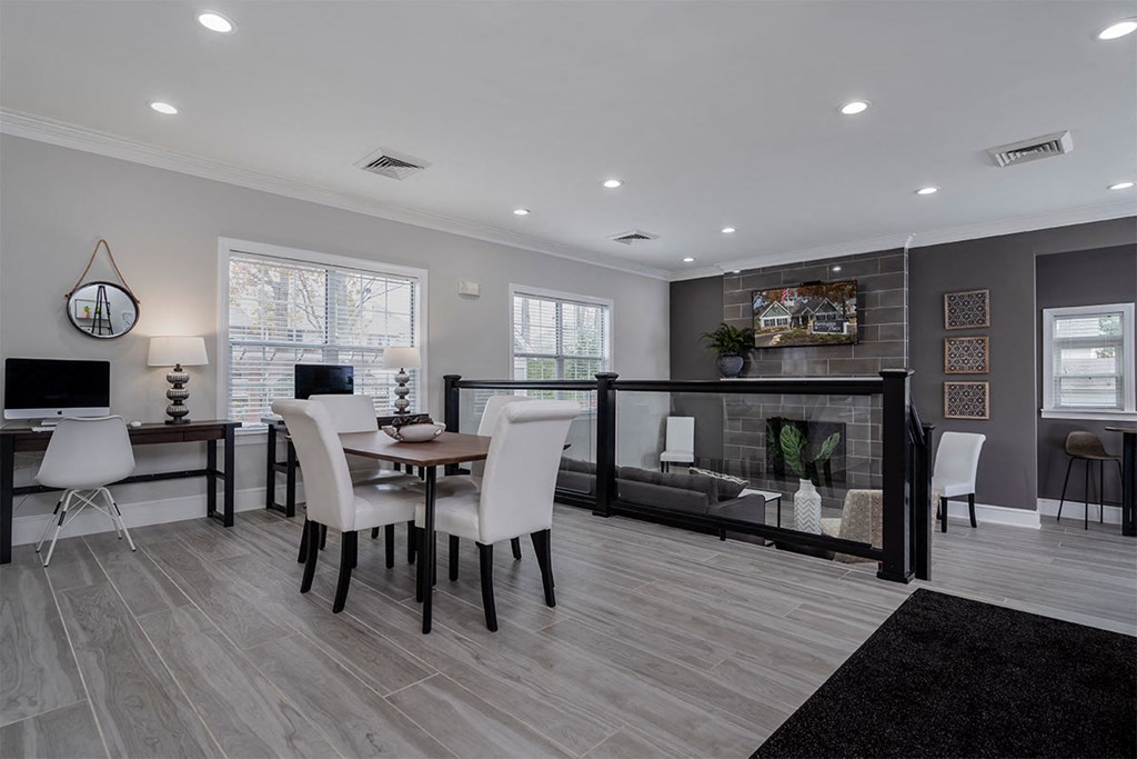 a dining room with a table and chairs and a fireplace
