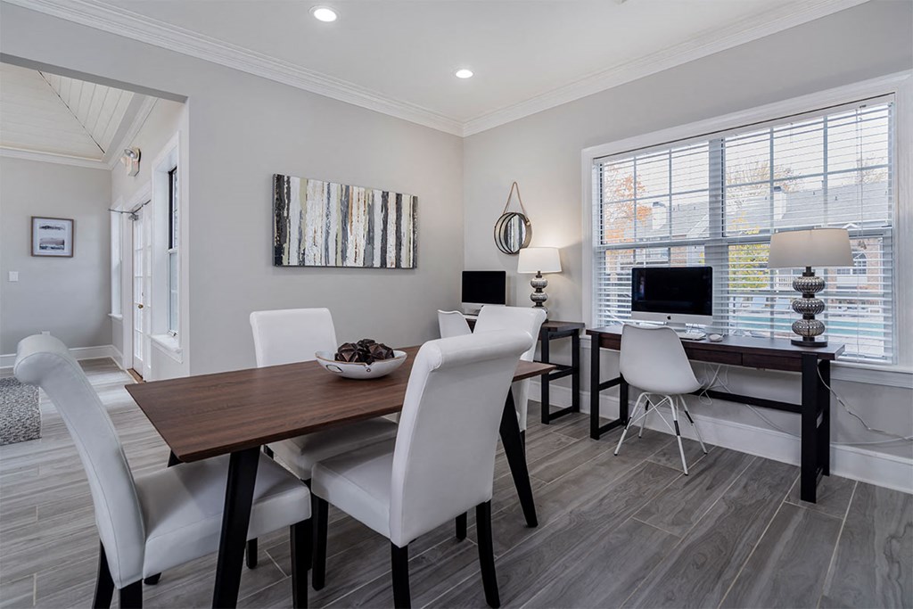 a dining room with a table and chairs