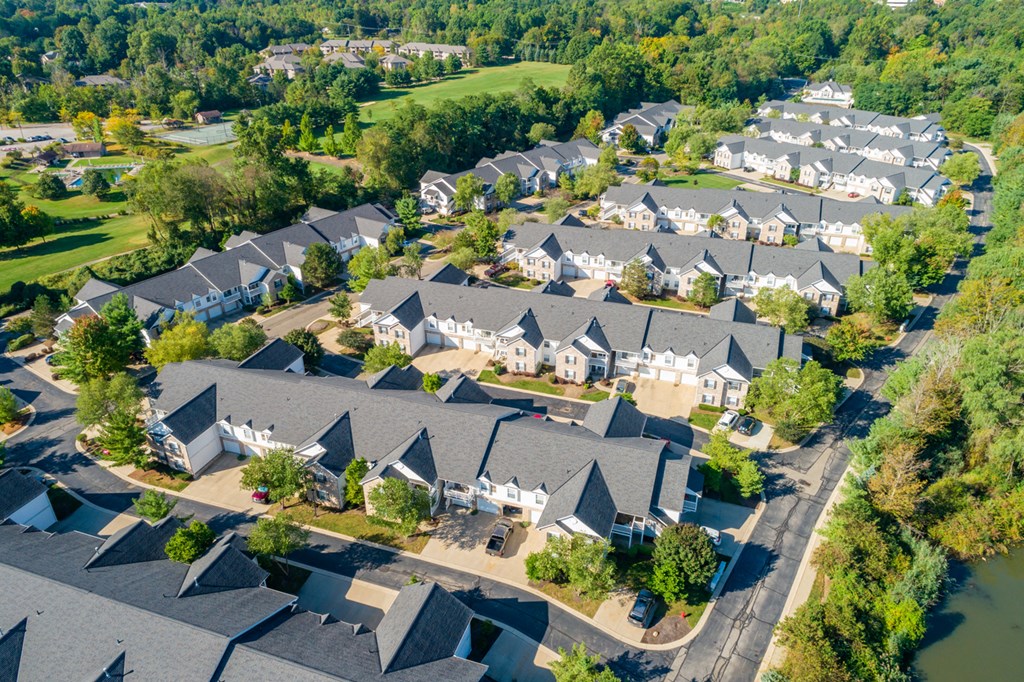 an aerial view of a neighborhood with rows of houses