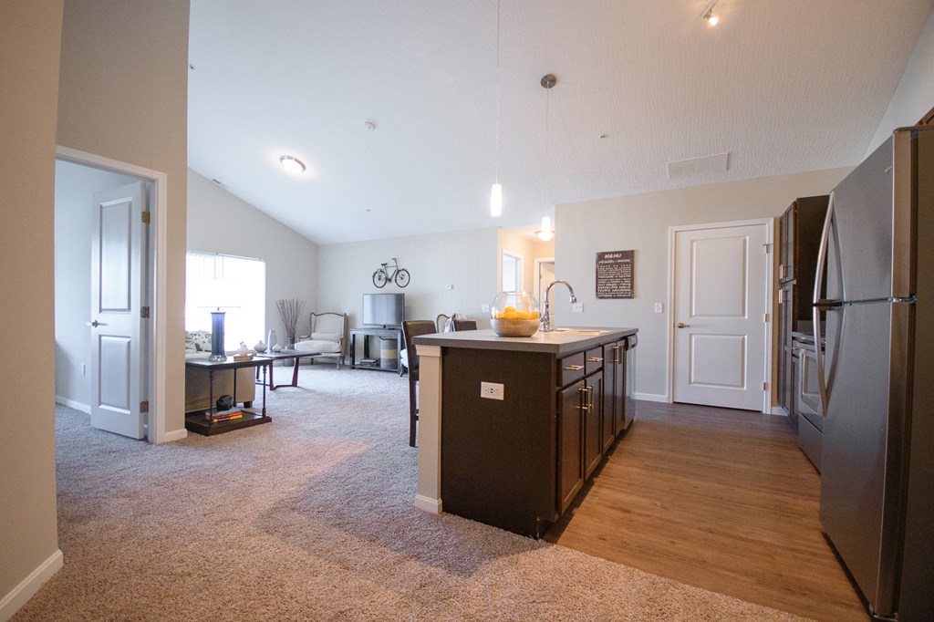 an open floor plan with a kitchen and living room