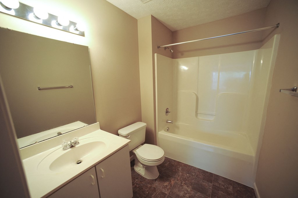 a bathroom with a sink toilet and a shower