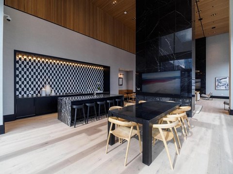 a dining room with a table and chairs and a tv