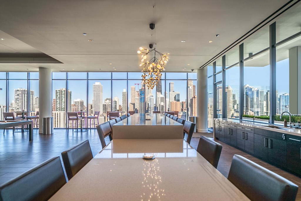 a dining room with a view of a city skyline