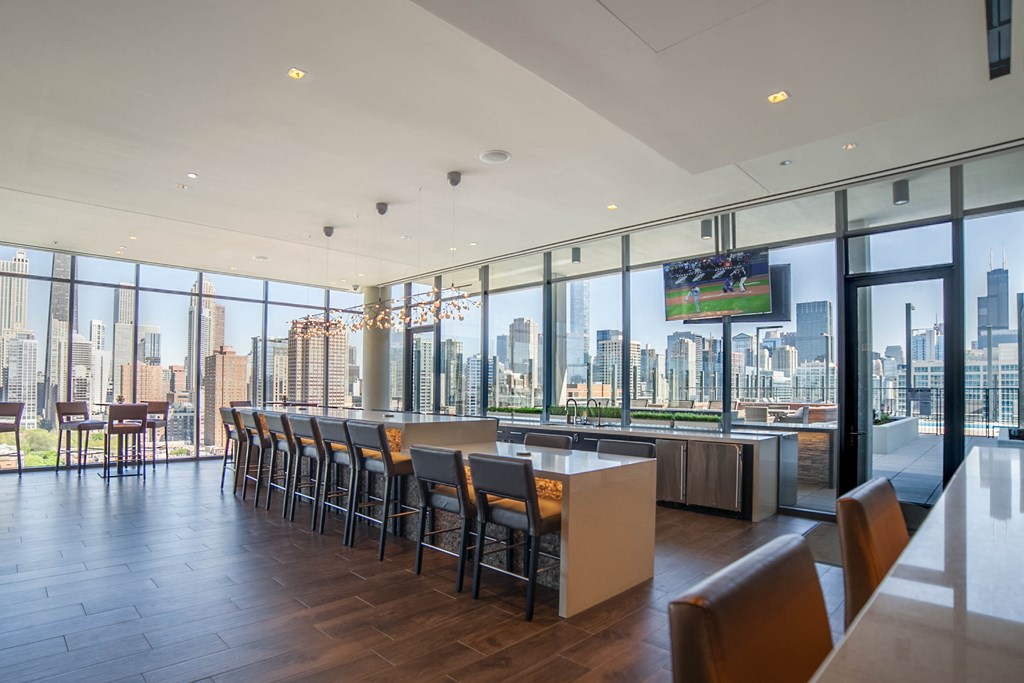 a dining room with a view of a city skyline