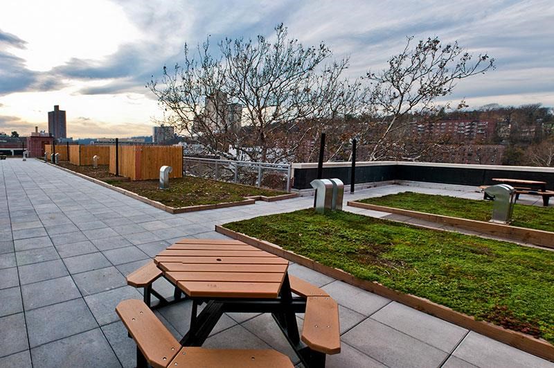 a group of picnic tables on a roof