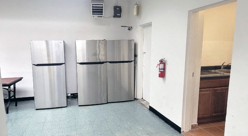 a kitchen with two refrigerators and a fire hydrant