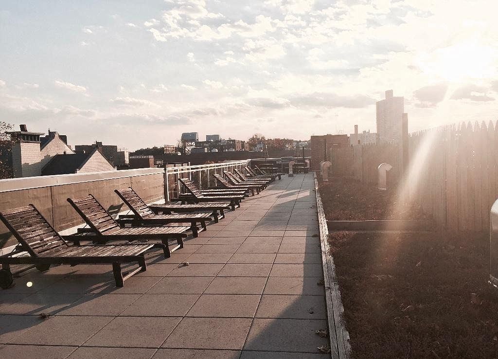 a row of wooden benches on a roof