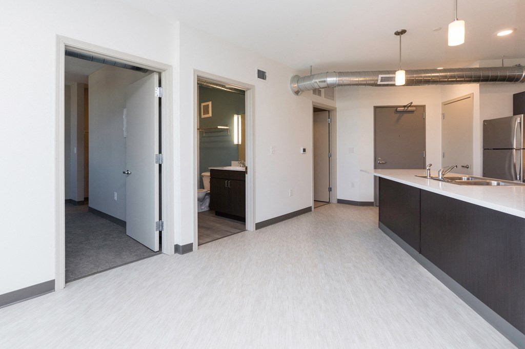 an empty kitchen and living room in a new apartment