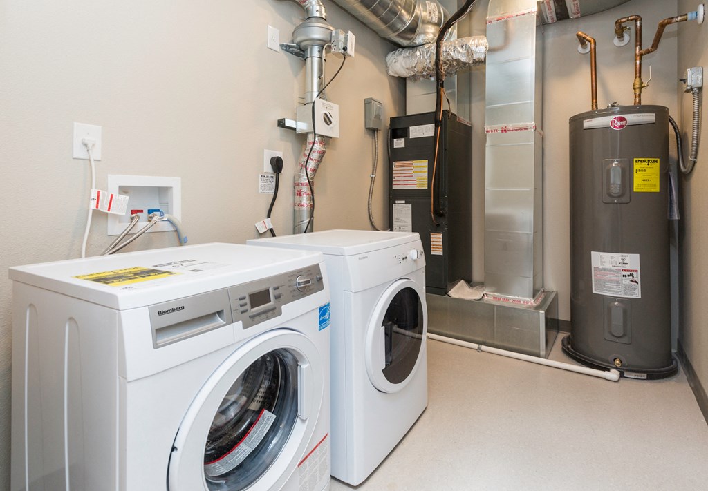 a laundry room with a washing machine and a dryer