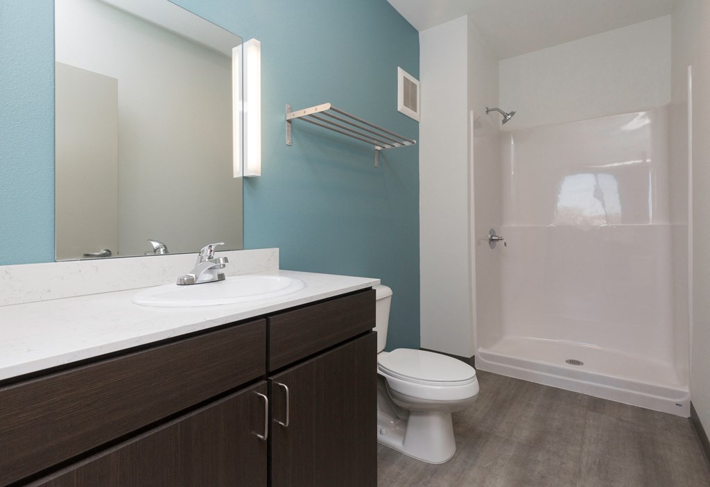 a bathroom with a sink toilet and a shower