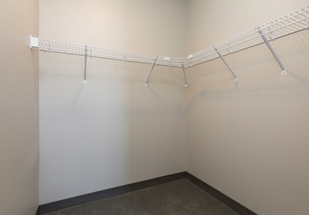 a large empty closet in a room with white walls