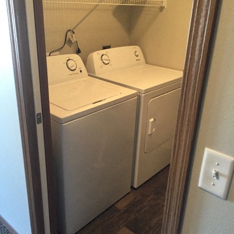 a washer and dryer in a room with a door