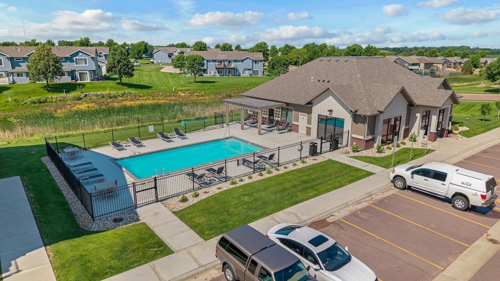 A large house with a pool in the backyard.