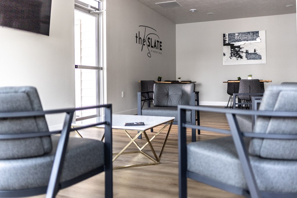 a living room with couches and chairs and a coffee table