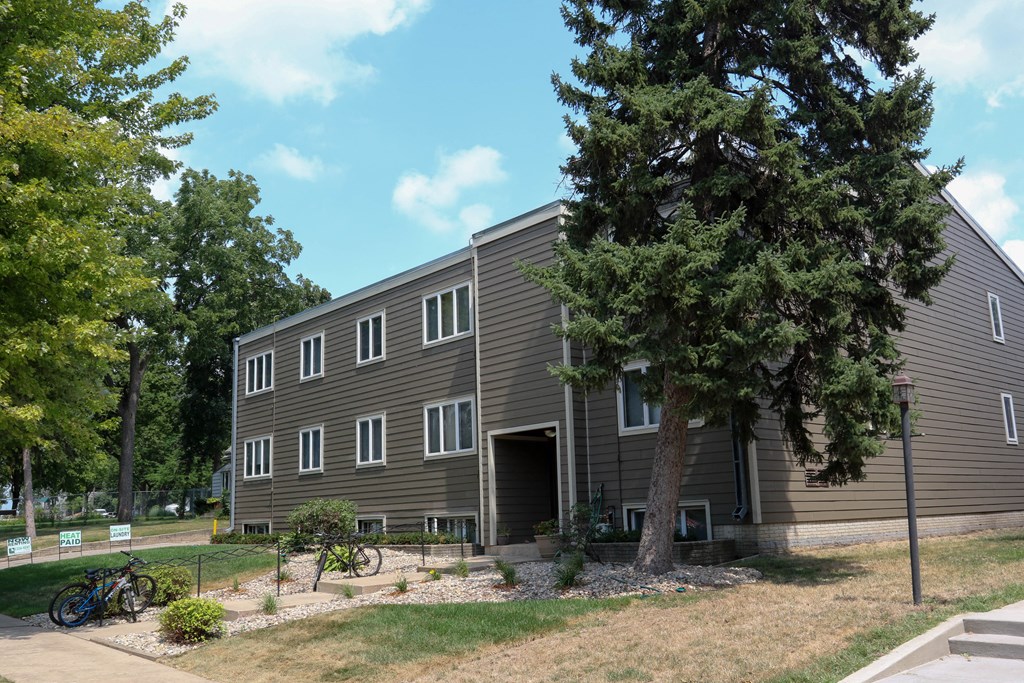a large building with a tree in front of it