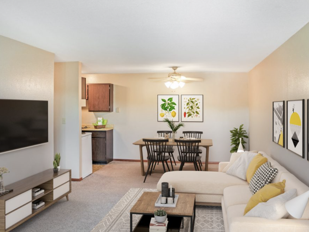 a living room with a couch and a dining room table