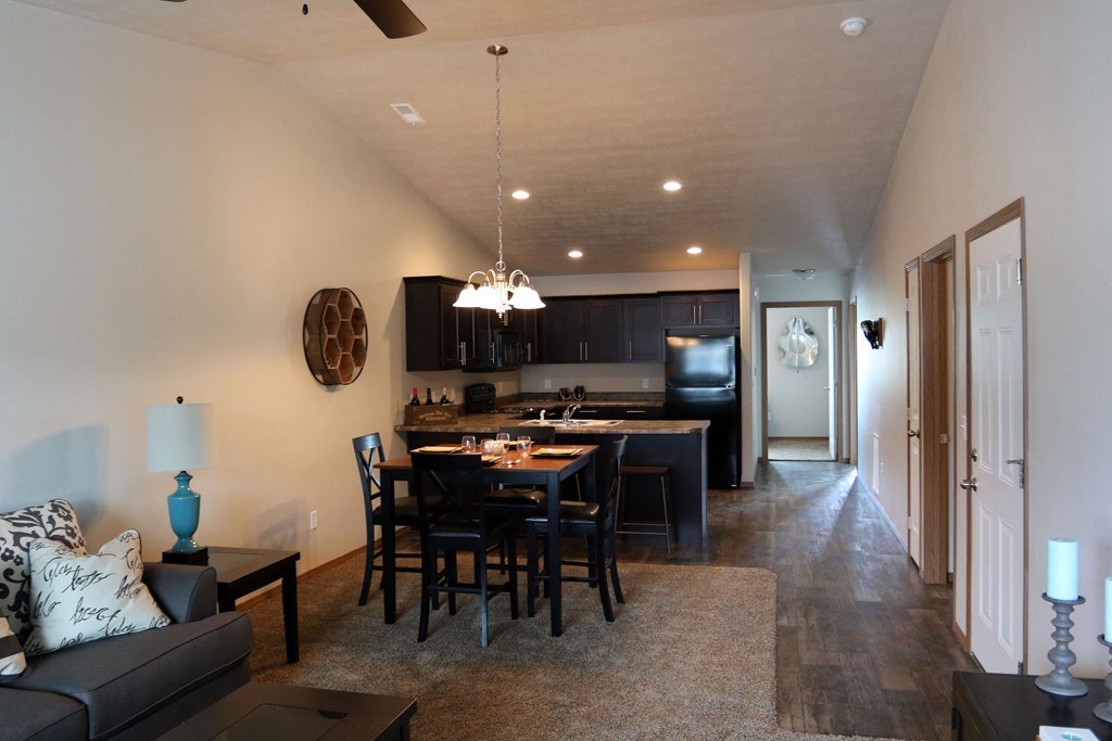the view of the living room from the dining room and kitchen