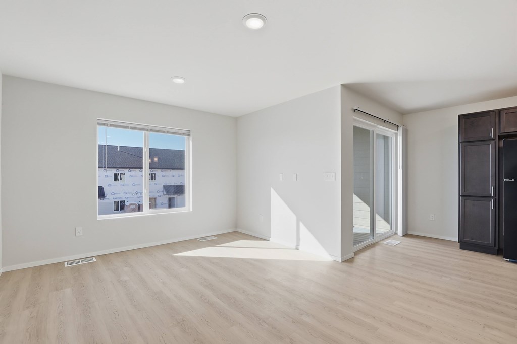 A room with a window and a door.