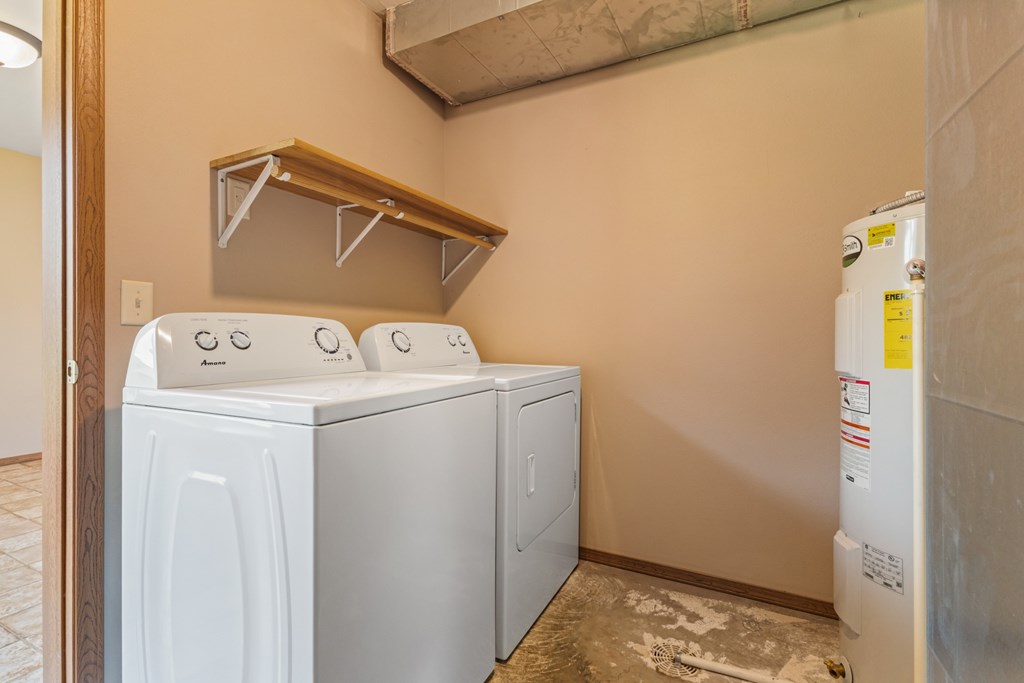 A laundry room with a washer and dryer.