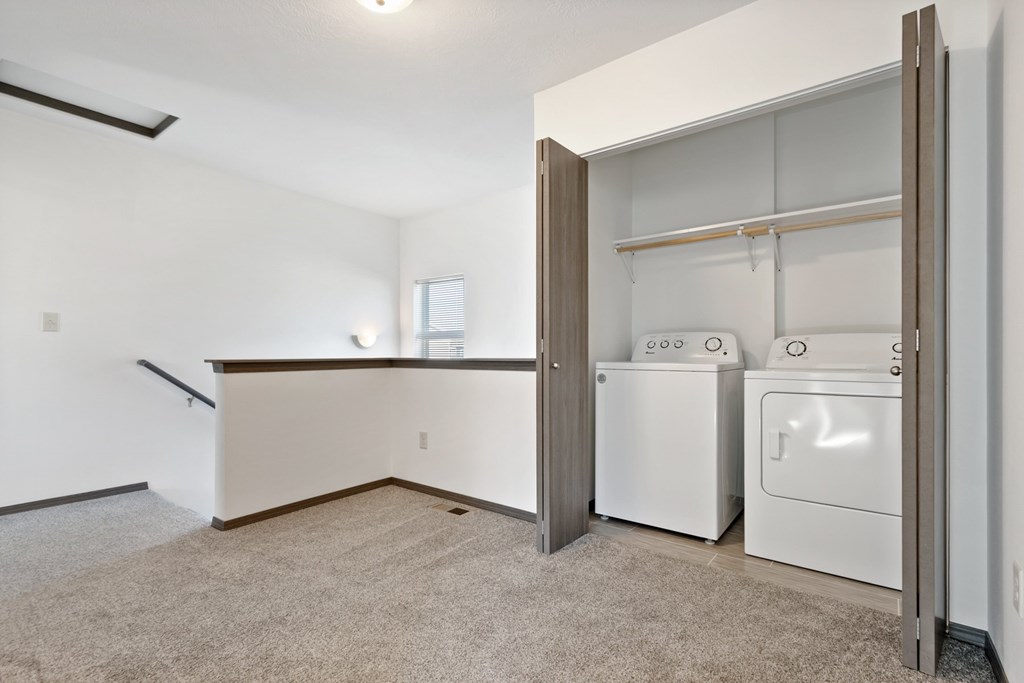 A laundry room with a washer and dryer in it.