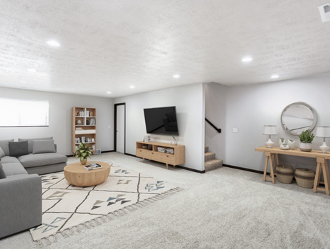 a living room with a couch and a tv