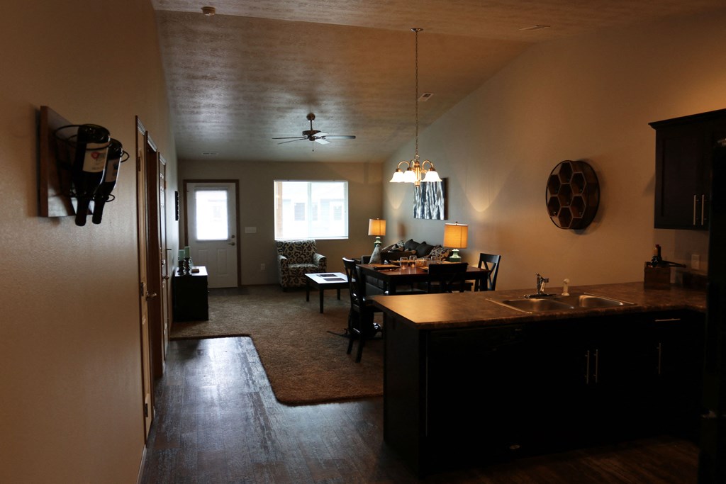 the view of the living room from the kitchen and dining room