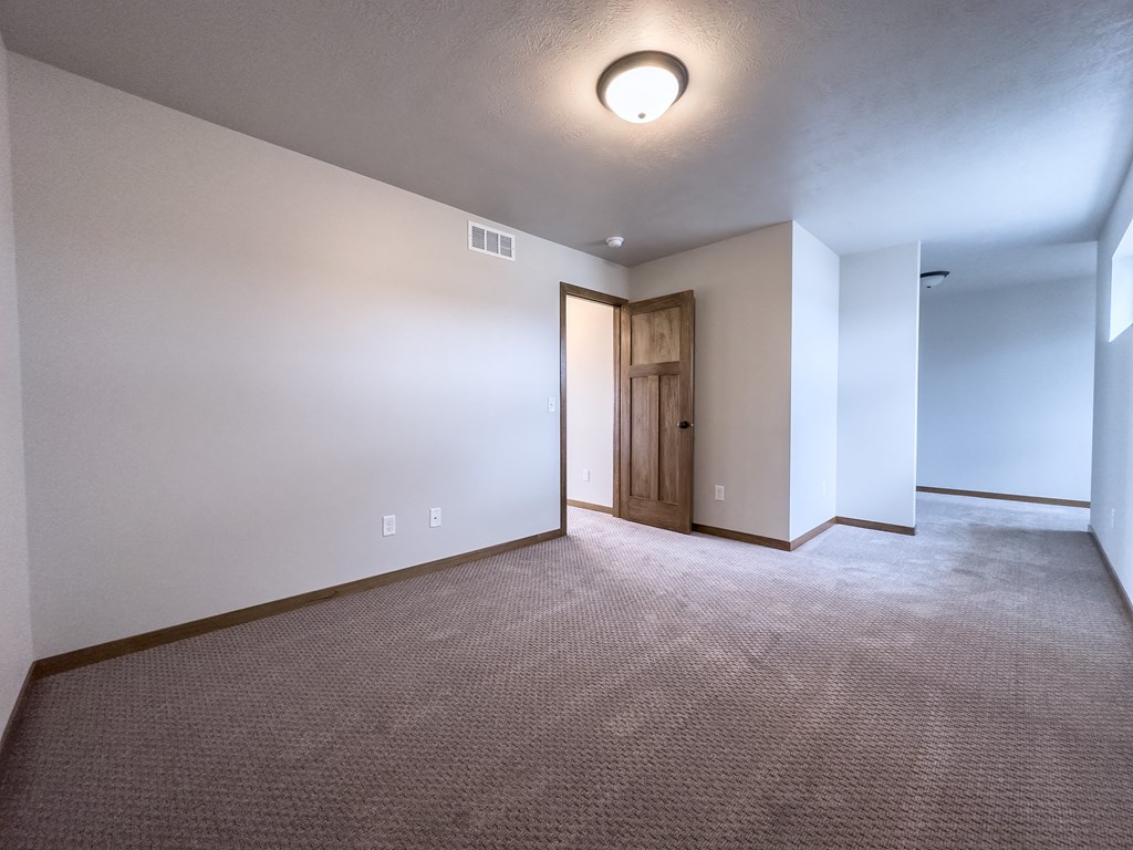 the upstairs living room is empty and ready for you to move in