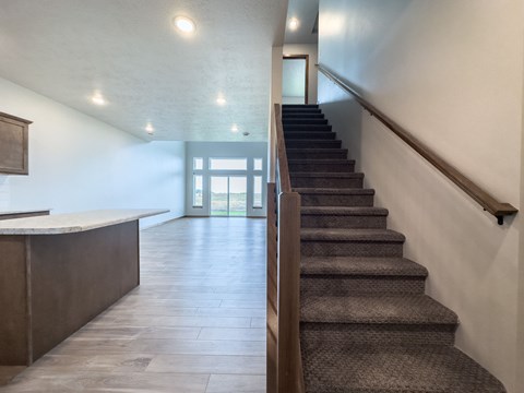 the view of the staircase from the bottom of the stairs in a house