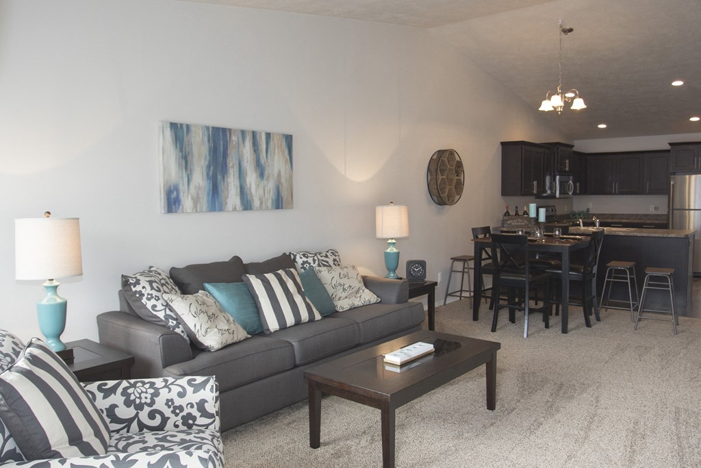 a living room and dining room with a couch and a table