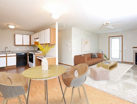 a living room and kitchen with a table and chairs